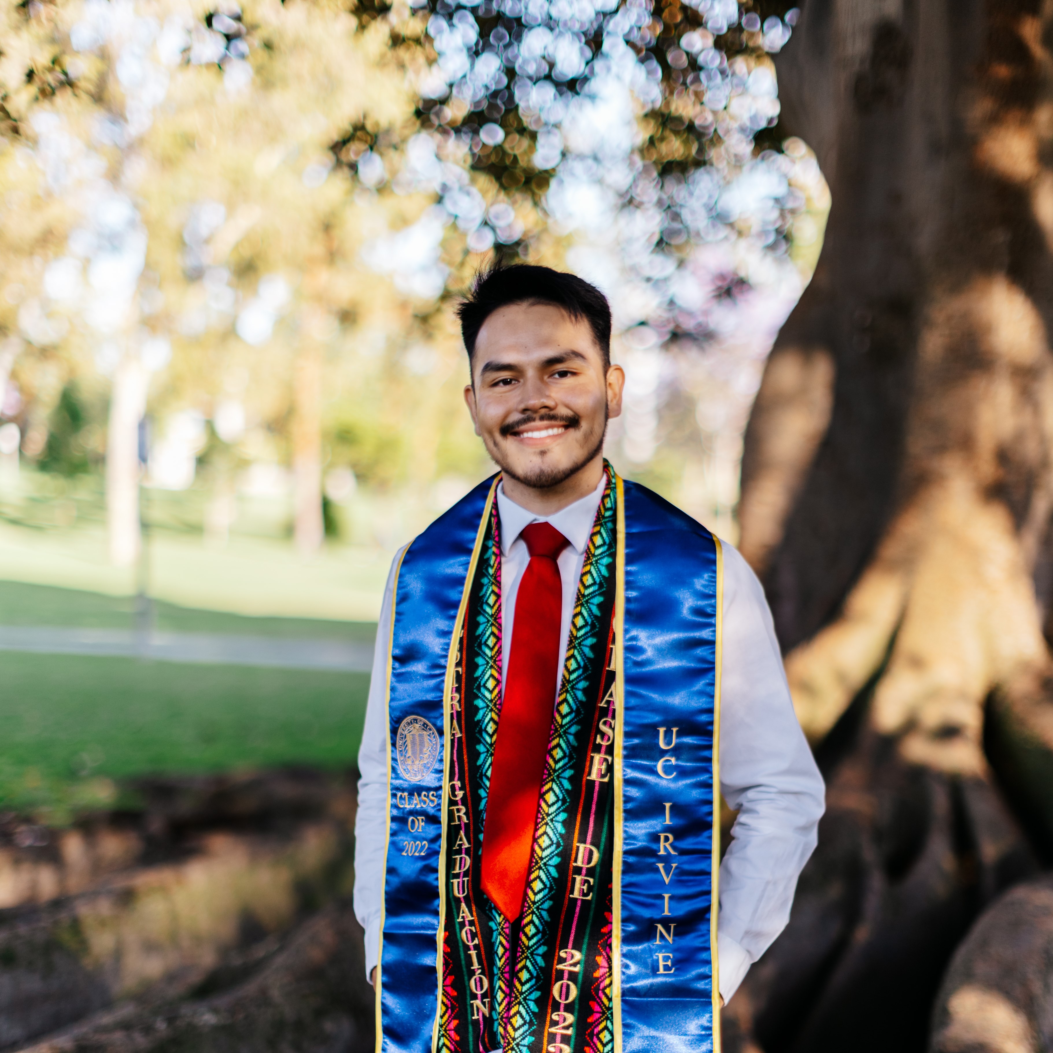 Grad picture of Luis Espino under a tree