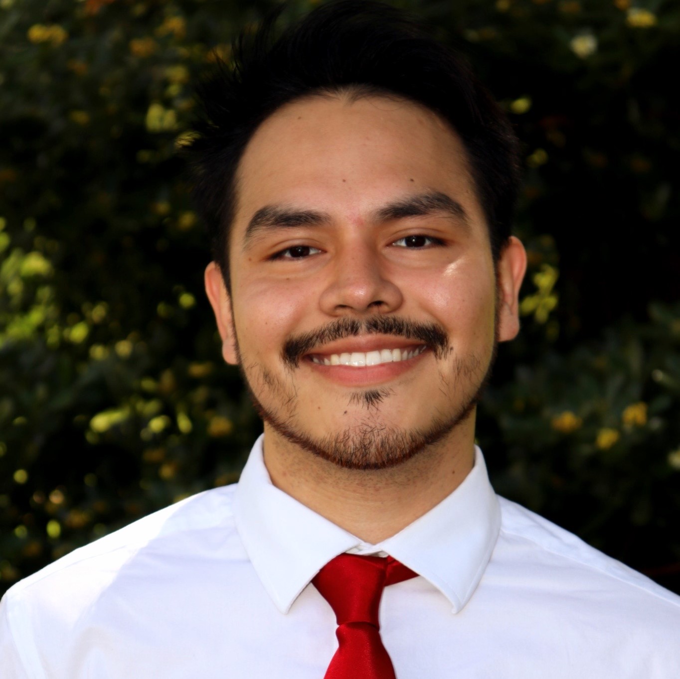 Picture of Luis Espino with red tie